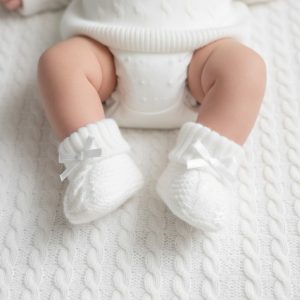 White Knitted Booties with Cable Detail & Bow – by Soft Touch (0–3 Months)
