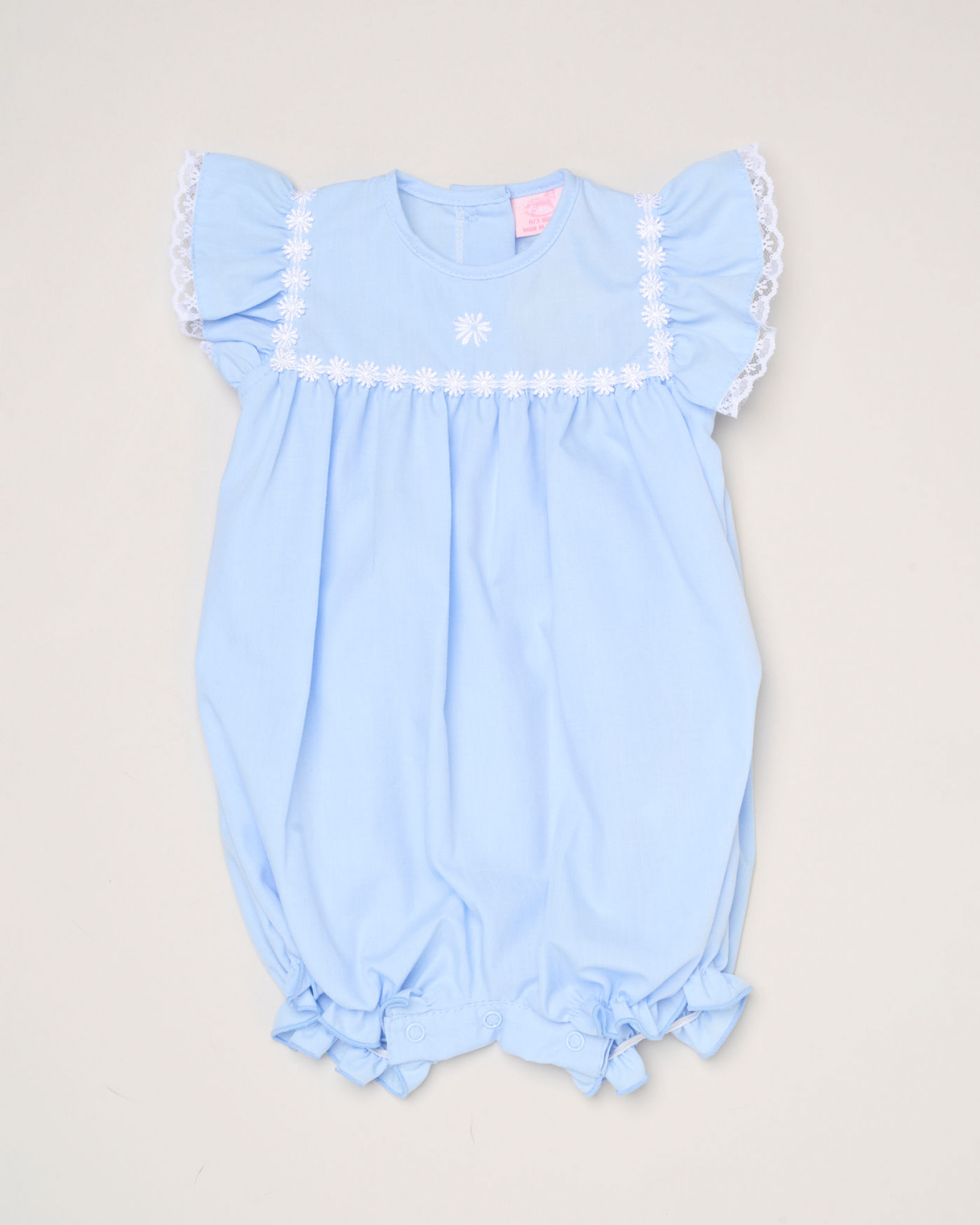 Blue or Pink Daisy Woven Romper – by Rock a Bye Boutique (0–9 months) - Image 4